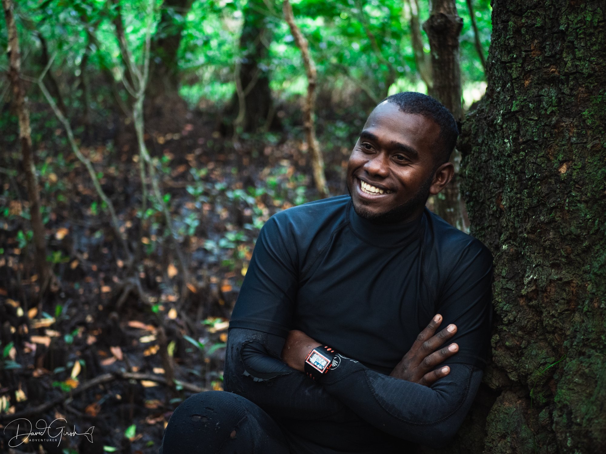 Diver with coral reef and orange fish