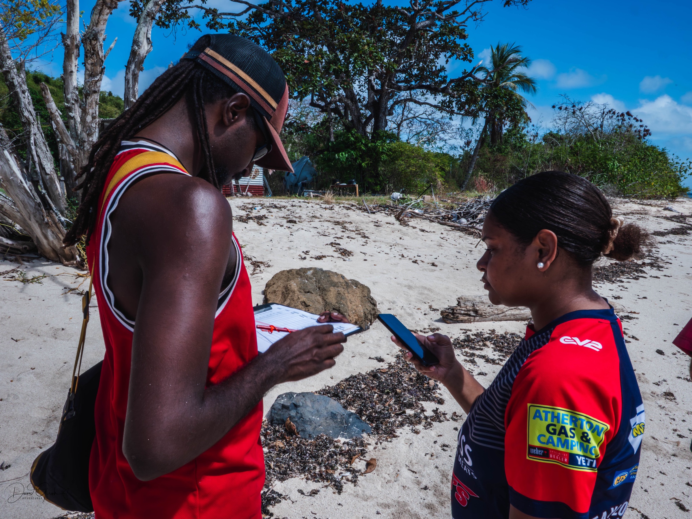 Checking the record together on the beach on Mer Island