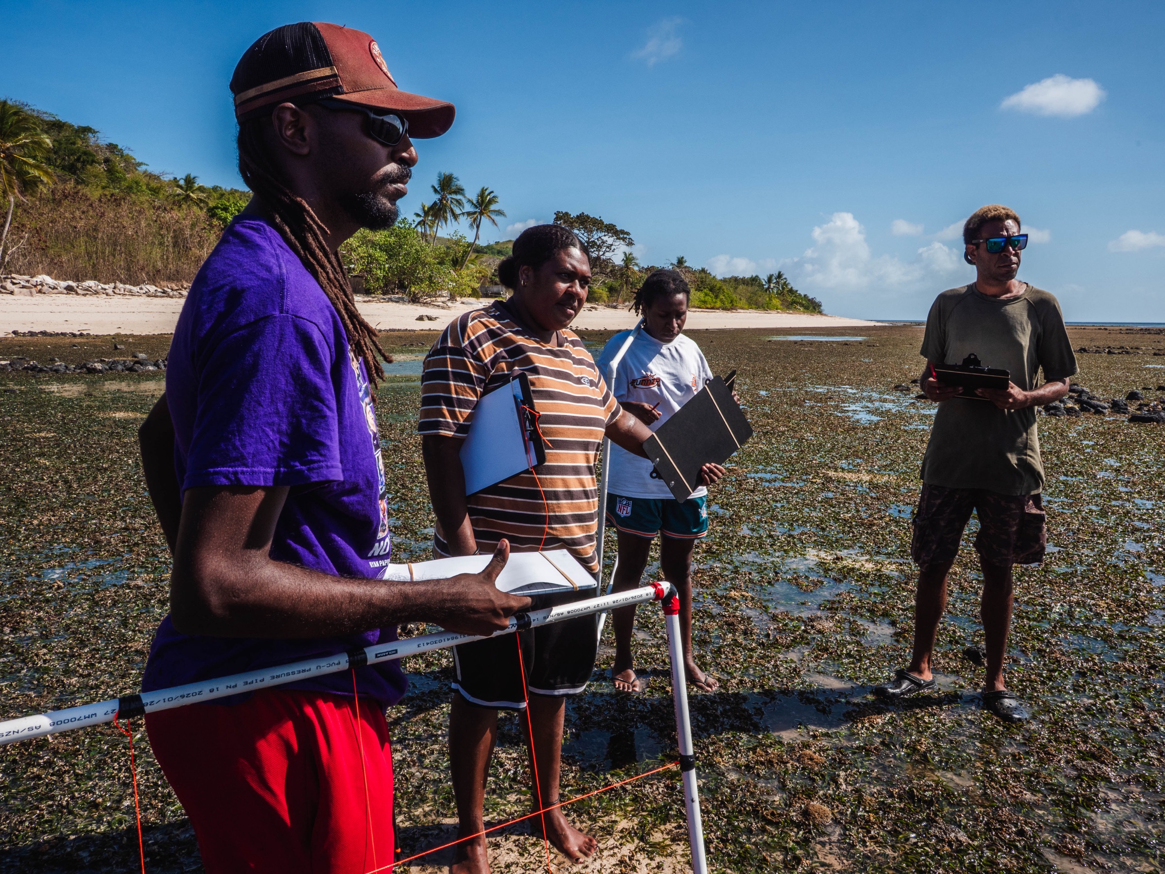 Community team recording quadrat survey data, Mer Island