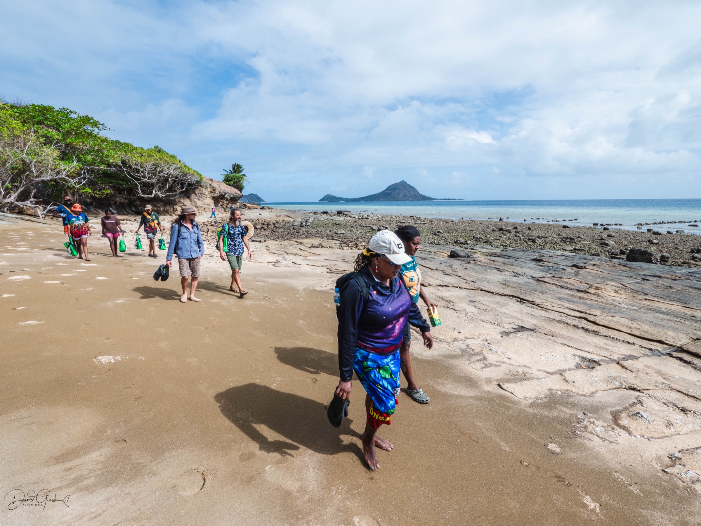 Walking out along the reef flat on Mer Island