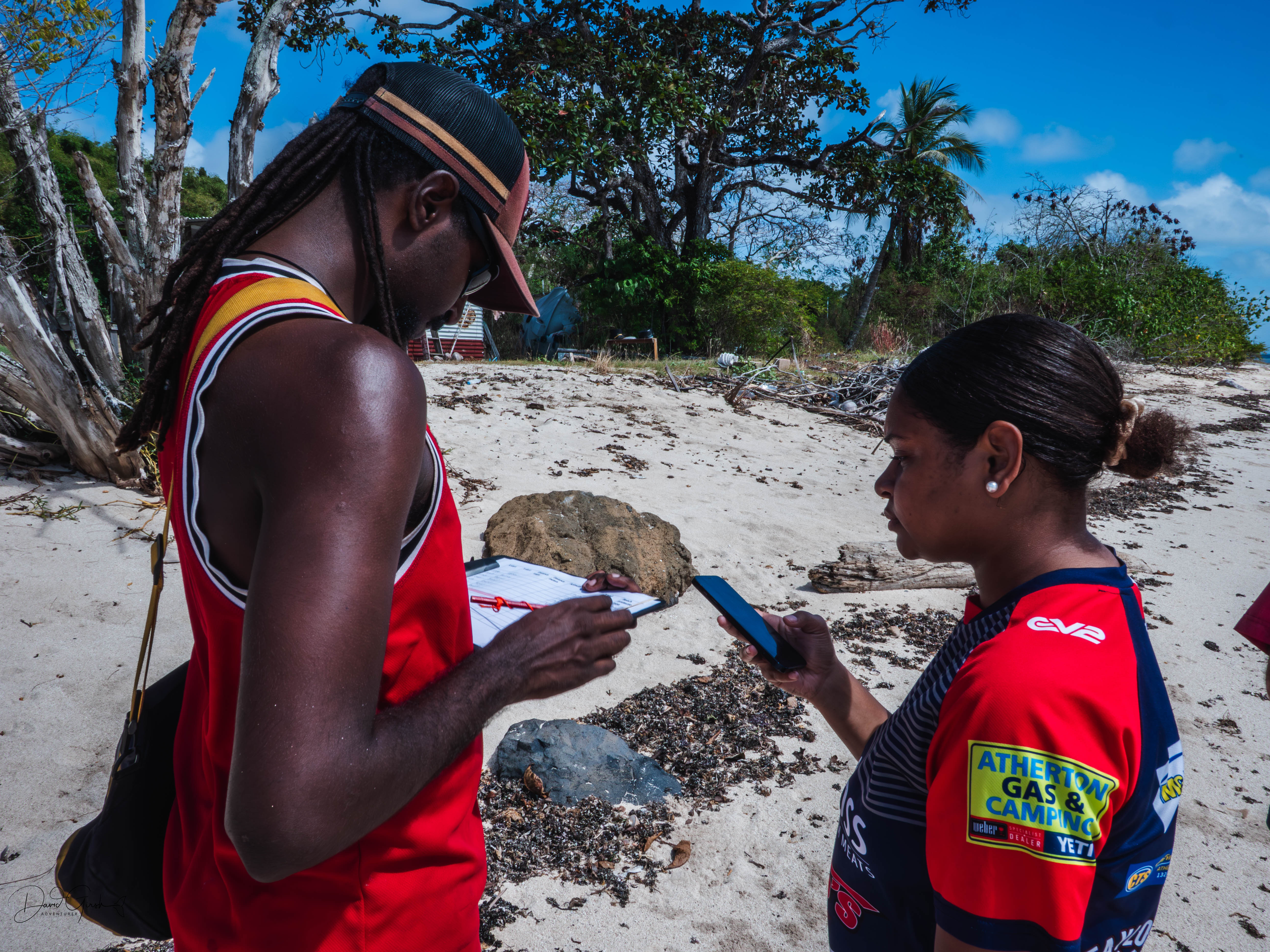 Checking the record together on the beach on Mer Island